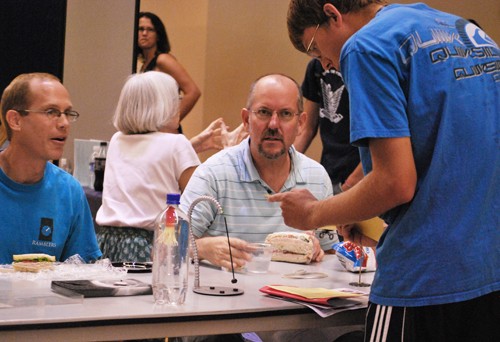 Valentina Martinelli/ Arizona Daily Wildcat

Tim Luensman, a engineering freshman speaks with Drew Milson, left, the director of Undergraduate Studies for the physics department and Charles Staflod, an associate professor in the physics department at the Meet Your Major fair in the SUMC Grand Ballroom on Wednesday, Sept 29. 