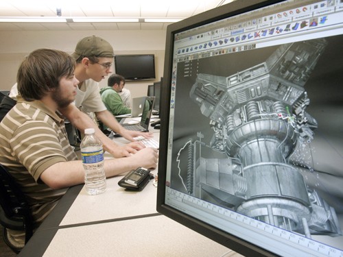 Johnson County Community College is one of many colleges offering degrees in video gaming. Here, Dallas Crossland, left, and Drew Misemer work together in an animation class at JOCO Community College, October 6, 2009, in Overland Park, Kansas. (Jim Barcus/Kansas City Star/MCT)