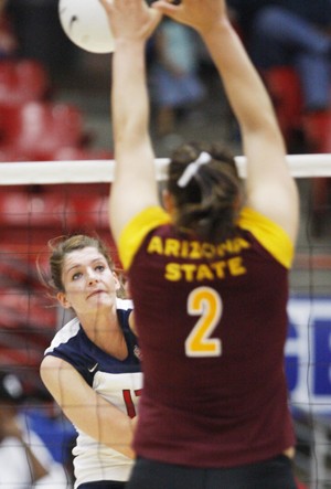UA opposite hitter Randy Goodenough swats the ball into ASU middle blocker Sonja Markanovich in a 3-0 Wildcat win in McKale Center on Oct. 1.