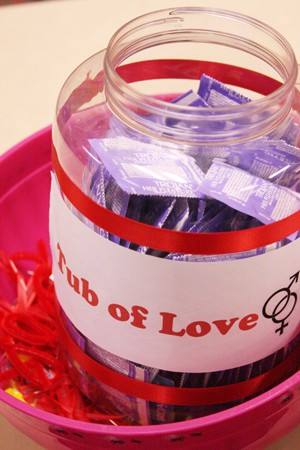 A glass jar of condoms dubbed the Tub of Love were offered to those in attendance Monday night at a Sex Education presentation in the SUMC. The presentation focused on informing the public about the threats of AIDS and HIV for World AIDS Day. 