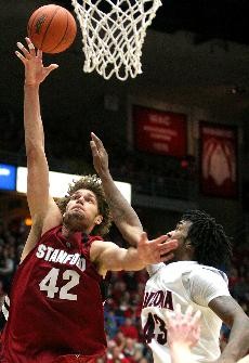 Stanford center Robin Lopez takes a shot over Arizona forward Jordan Hill during the Wildcats 67-66 loss to the Cardinal Saturday in McKale Center.  Hill fouled out after scoring just five points and grabbing four rebounds.