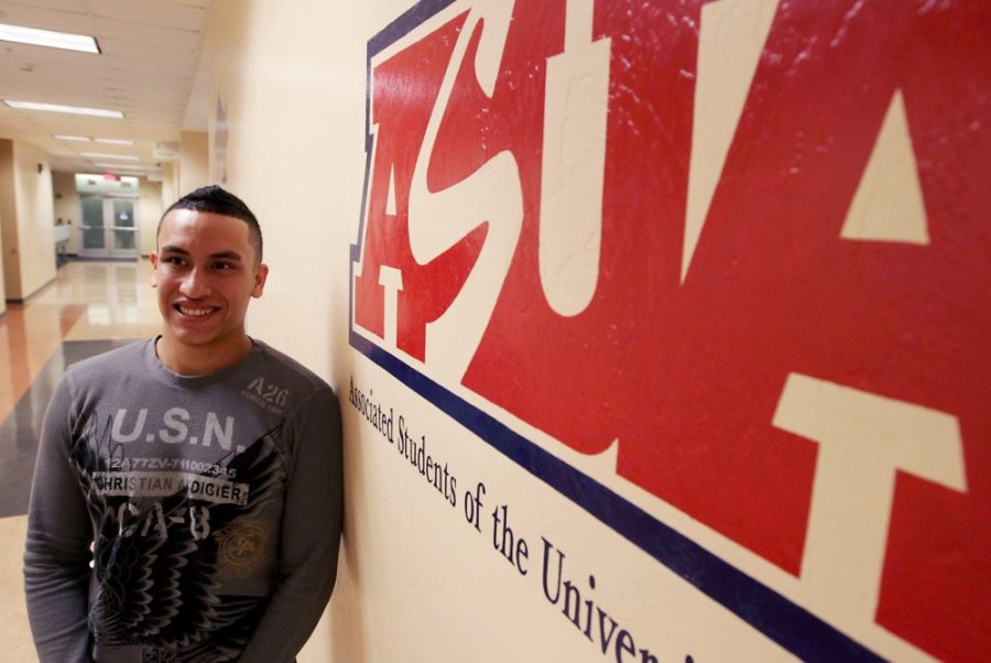 Gordon Bates / Arizona Daily Wildcat 

Marc Small, a political science and pre-business sophomore, has recently been elected as an ASUA senator on Wednesday, Jan. 11 in the conference room of the ASUA office.