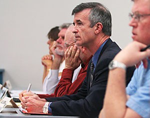 President Robert Shelton listens in on the Faculty Senate meeting yesterday afternoon in the James E. Rogers College of Law building.