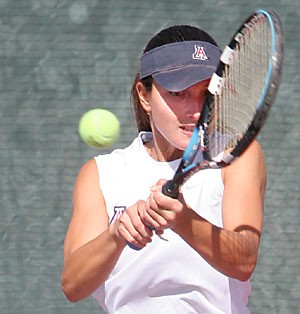 Arizona senior tennis player Iza Ferreira takes a swing during the Wildcats home win against Pacific on Jan. 27. The Brazilian native will be in action again at home this weekend as the Wildcats take on Cal Poly and Denver. 