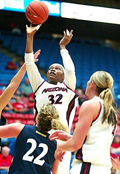 Arizona forward Amina Njonkou (32) takes a shot during last nights 76-70 exhibition win over Vanguard in McKale Center. Njonkou scored 16 points and grabbed a team-high 13 rebounds. 