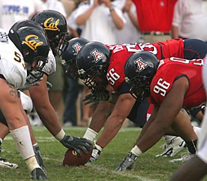 The defensive line gets set for the snap during Arizonas Homecoming win over California last season. The Wildcats will mix young talent and 10 returning starters on the defensive side of the ball with hopes to finish better than fourth in the Pac-10, where they placed last season.  
