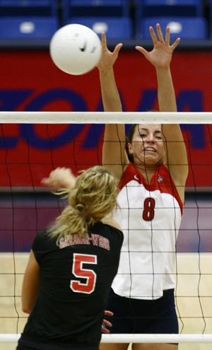 Wildcat freshman Amy Webster leaps for a block in a 3-0 win against Gardner-Webb on Aug. 30 in McKale Center.