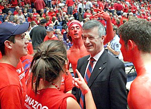 Claire C. Laurence/Arizona Daily Wildcat

Future University President Robert Shelton visits with fans in the student section on Saturday in McKale Center. Shelton got the crowd roaring at half-time as he announced his loyalty to Wildcats Basketball.