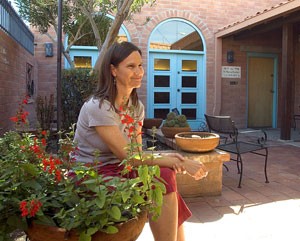 Randi Kisiel, executive director of the Little Chapel of All Nations relaxes in the chapels secluded courtyard where people of any, or no, faith are welcome to visit.