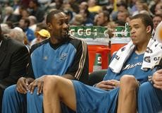 Washington Wizards point guard Gilbert Arenas, left, sits on the bench with forward Caron Butler during the second half of a 124-115 loss to the Indiana Pacers in Canseco Fieldhouse on Sunday night. Arenas, a former Wildcat, did not play, although he made his season debut Saturday night against Detriot. 