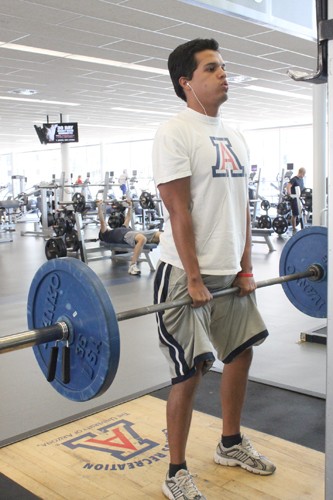 Lisa Beth Earle/ Arizona Daily Wildcat

Steve Romero, a mathematics junior, works out at the Student Recreation Center on Thursday, June 3. Students who are not enrolled in classes are required to pay a $25 fee per session to use the Rec Center during the summer.