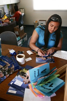 Sam Shumaker/ Arizona Daily Wildcat

Kiona Meade, a freshman majoring in bio-systems engineering, labels folders Wednesday afternoon for volunteers that will be working a science conference on campus Saturday meant for girls in middle and high school to do hands on experiments and meet other women in careers involved with science.