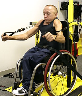 Paralympic athlete and UA graduate student Kyle Mutz works out at Mobility Fitness gym in Tucson. Mutz has been training for the 2008 Paralympic Games, which will be in Beijing next summer, while simultaneously taking classes at Arizona. 