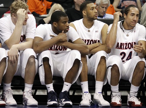 Colin Darland/ Arizona Daily Wildcat

From left; Arizona basketball players Kyryl Natyazhko, Kevin Parrom, Jamelle Horne and Brendon Lavender look on in disappointment during the Wildcats NCAA Tournament streak-ending loss to UCLA in the Staples Center on Thursday.