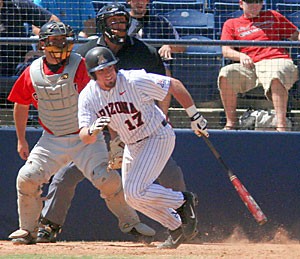 Arizona junior catcher Konrad Schmidt starts his run to first after connecting with a pitch in the Wildcats 7-5 win over Southern Utah at Sancet Stadium in late April. 