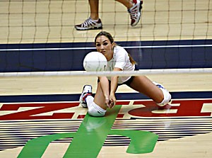 Libero Katie Jackels drops down for a dig during practice Tuesday in McKale Center. The senior, who started only six times last season, battled her roommate, junior Brittany Leonard, for the starting role this season.