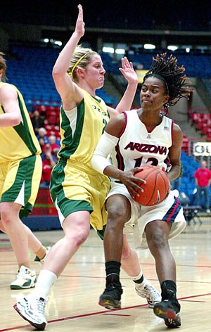 UA guard Ashley Whisonant, right, tries to work around an Oregon defender in a 65-60 win over the Ducks in McKale Center on Jan. 31. Whisonant leads the Pac-10 with 37.1 minutes per game and needs to play 146 more minutes to reach the 1,000-minute mark this season.