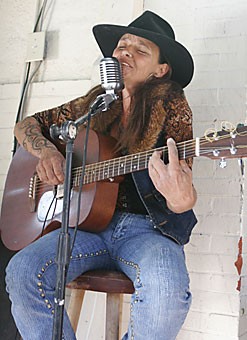 Local musician Terry Wolf performs at the saloon at the Copper Queen.
