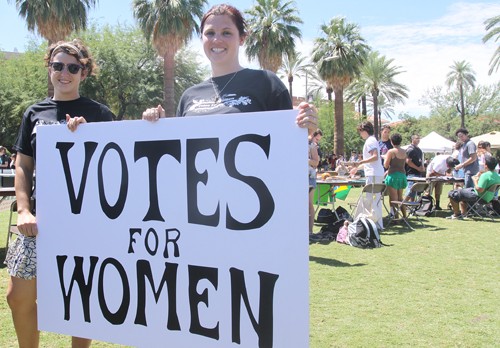 Erich Healy/ Arizona Daily Wildcat

Kate Stogsdill(left), history senior; and Jessica Whitson (right), spanish senior, recreate a historical picture to promote womens suffrage. The Womens Resource Center and Arizona Student Association were encouraging voter registration on the UA Mall Wednesday.