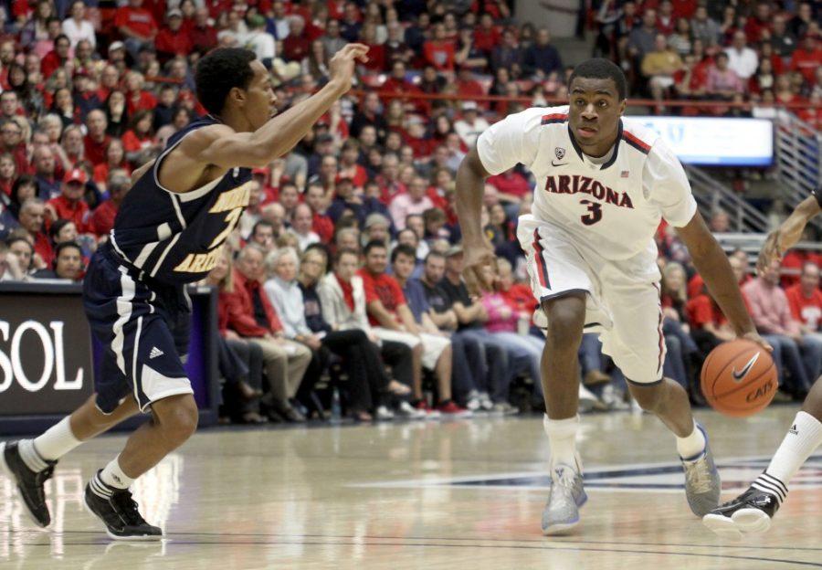 Janice Biancavilla/ Daily Wildcat

No. 3, Kevin Parrom, drives to the hoop against Northern Arizona University on Dec. 3 at McKale Center. 
