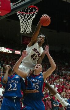 UA forward Jordan Hill grabs a rebound against Kansas in the Wildcats 84-69 win in McKale Center on Dec. 23. Arizona enters its Pacific 10 Conference schedule tonight against California.