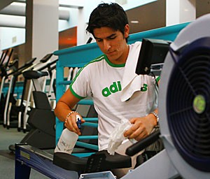After a tiring run on a rowing machine, business freshman Daniel Ortega wipes his machine down with a disinfectant spray. Sweat left on machines and in locker rooms can carry methicillin-resistant Staphylococcus aureus, a bacterium that can cause pneumonia, blood infections and, in rare cases, death. 