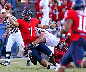UA quarterback Willie Tuitama goes down at the hands of Stanford defensive end Erik Lorig (80) during the Wildcats 21-20 loss to Stanford on Saturday at Arizona Stadium. Tuitama and the rest of the team are now 2-6 overall and find their bowl hopes even less obtainable. 