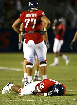 UA running back Chris Jennings (28) lies in the grass during the Wildcats 29-27 loss to New Mexico in Arizona Stadium on Sept. 15. Arizona finished the season sixth in the Pacific 10 Conference.