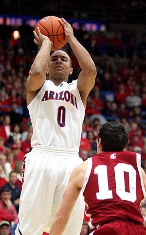 Arizona guard Jerryd Bayless shoots over Washington States Taylor Rochestie in the Wildcats 76-64 win over the Cougars Thursday in McKale Center. The Wildcats will next be in action at USC on Jan. 31. 