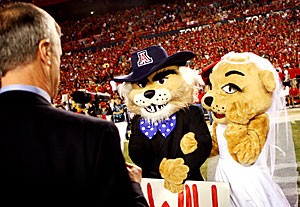 Before a crowd of 85,754 fans, Wilbur and Wilma Wildcat renew their marriage vows with President Robert Shelton presiding over the ceremony. The two UA mascots were originally wed during the halftime of the 1986 UA homecoming game, and this season marks their 20th wedding anniversary.