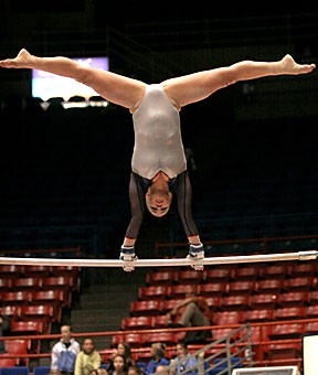 Freshman gymnast Briana Bergeson competes on the uneven bars for the Gymcats Feb. 3. Arizona has won three meets in a row and head to Stanford tonight with Bergeson leading the way on balance beam and uneven bars.