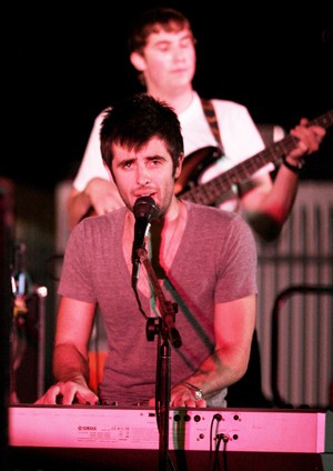 Zak Stucchi, front, and Philip Bloom of the band Blueskyreality perform at Bear Down Field Friday night at the Rock for a Wish benefit concert presented by the Chi Omega sorority.