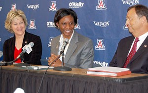 From left, UA senior associate athletics director Rocky LaRose, Niya Butts and UA athletics director Jim Livengood address the media yesterday in McKale Center. Butts was named the womens basketball teams eighth head coach yesterday after Livengood fired Joan Bonvicini nearly three weeks ago.