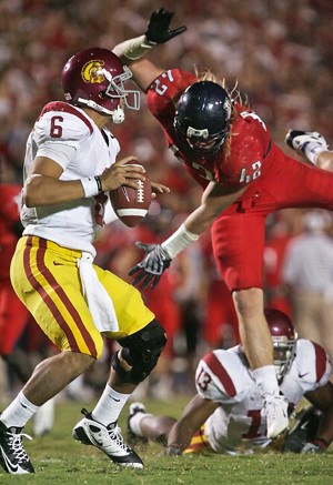 UA defensive end Brooks Reed hurls himself toward USC quarterback Mark Sanchez during a 17-10 Trojan win Saturday night at Arizona Stadium. The loss drops the Wildcats to 5-3 overall and 3-2 in the Pac-10 Conference.