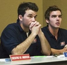 ASUA senators Stephen Wallace (left) a pre-physiology sophomore, and Bryan Baker, a history and education junior, listen to discussion during the weekly ASUA Senate meeting last night in the Tubac room of the SUMC. 