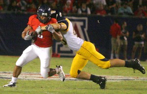 Arizona running back Keola Antolin tries to evade a tackle in the Wildcats 41-16 win over Toledo at Arizona Stadium on Saturday. Antolin was named the Pacific 10 Conference Special Teams Player of the Week on Monday for his performance against the Rockets.