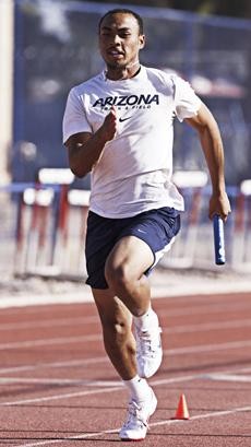Wildcat sprinter Chris McSwain runs a relay during practice at Drachman Stadium on Wednesday. The freshman is trying to qualify for the NCAA Regional Championships in Eugene, Ore.