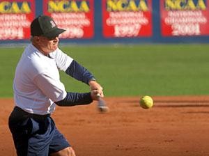 Interim softball head coach Larry Ray hits a ball for infield practice yesterday. The Wildcats will open up their season in the Kajiwaka Classic in Tempe Feb. 15, without legendary head coach Mike Candrea, who will coach the USA Olympic softball team in Beijing.   
