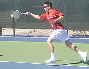 Arizona redshirt junior Jason Labrosse prepares to hit during a match in early March. Labrosse is planning on graduating with a year of eligibility remaining to pursue a business career.