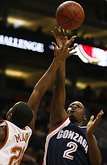 Gonzagas Jeremy Pargo (2) shoots over Texas guard Justin Mason during the first half of Gonzaga Hall of Fame challenge game against Texas, Saturday December 2, 2006 at US Airways Arena in Phoenix.
