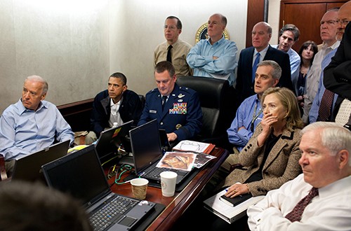 President Barack Obama and Vice President Joe Biden, along with with members of the national security team, receive an update on the mission against Osama bin Laden in the Situation Room of the White House in Washington, D.C., May 1, 2011. Seated, from left, are: Brigadier General Marshall B. "Brad" Webb, Assistant Commanding General, Joint Special Operations Command; Deputy National Security Advisor Denis McDonough; Secretary of State Hillary Rodham Clinton; and Secretary of Defense Robert Gates. Standing, from left, are: Admiral Mike Mullen, Chairman of the Joint Chiefs of Staff; National Security Advisor Tom Donilon; Chief of Staff Bill Daley; Tony Binken, National Security Advisor to the Vice President; Audrey Tomason Director for Counterterrorism; John Brennan, Assistant to the President for Homeland Security and Counterterrorism; and Director of National Intelligence James Clapper. Please note: a classified document seen in this photograph has been obscured. (Pete Souza/The White House/MCT)