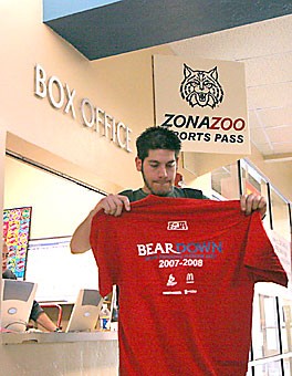 Engineering management junior Joel De La Rosa picks up this years Zona Zoo T-shirt at the Student Unions box office. This is the fourth year in a row De La Rosa is a Zona Zoo member, he said.