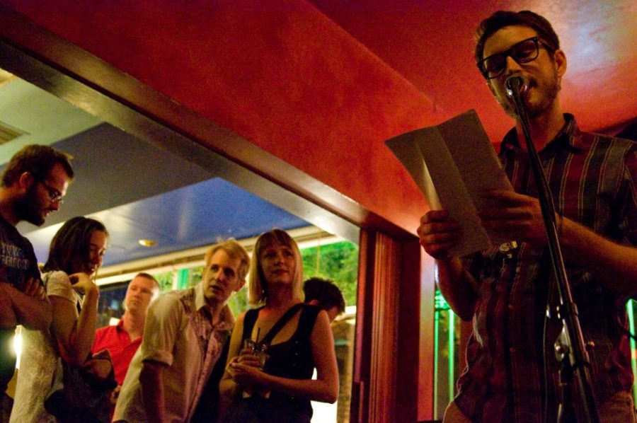 Andrew Shuta recites his poetry to a packed Red Room during the Poetry Fuckfest on Saturday Aug 29.  The Poetry Fuckfest raises money for the Sonora Review.
