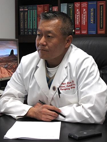 Dr. Peter Rhee, medical director of the trauma center at the University Medical Center, answers questions during an interview in his office on Wednesday, Jan. 19, 2011 in Tucson, Ariz.  Rhee is one of the physicians attending Rep. Gabrielle Giffords as she recovers from a gunshot wound to her brain.