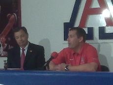 Jim Livengood, left, and Russ Pennell address the media Friday in McKale Center. Pennell will serve as the Arizona mens basketball teams interim head coach.