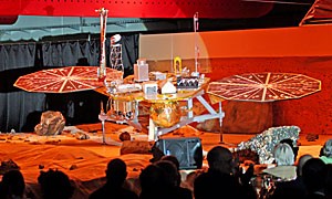 Attendees watch as the Phoenix Mars Lander is unveiled Friday afternoon at the Lunar and Planetary Laboratory. The probe, scheduled to launch August 2007, is the first university-led NASA mission to Mars.  