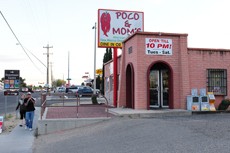A large sign marks soars above the restaurant Poco & Moms, located at 1060 S. Kolb Rd. The restaurant specializes in American and New Mexican style food.