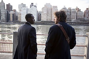 Don Cheadle, left, and Adam Sandler, right, star in the drama Reign Over Me. The film follows Sandler as his character deals with the loss of his family in the 9/11 terrorist attacks. Bring along a box of tissues for this one.