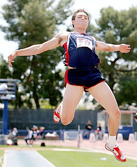 Junior Robert Arnold soars through the air during the long jump event of the mens decathlon March 23 at Drachman Stadium. Arizona track and field athletes will begin competition in the Long Beach Invitational tomorrow.
