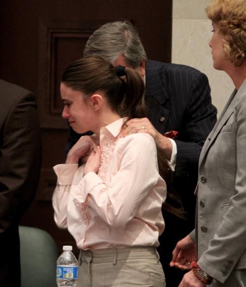 An emotional Casey Anthony with her attorneys after being acquitted of murder charges at the Orange County Courthouse in Orlando, Fla., on Tuesday.